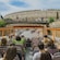 Guests riding a panoramic open air bus and looking at views of the Colosseum in Rome, Italy